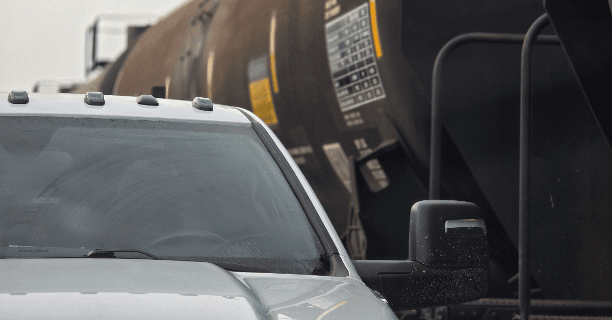 Repair truck alongside a tank railcar at a repair facility